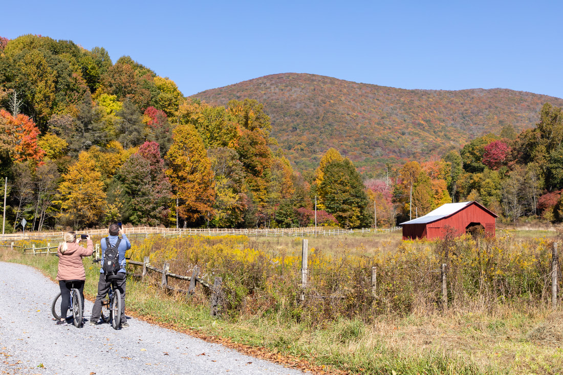 Family-friendly biking on the Virginia Creeper Trail with views of Whitetop Mountain from Green Cove Station near Damascus Virginia
