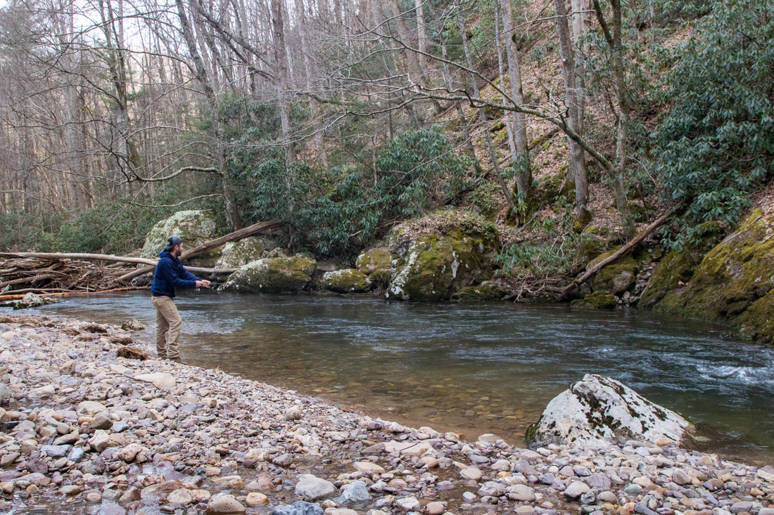 Fishing on Whitetop Laurel trout stream along the Virginia Creeper Trail near Damascus